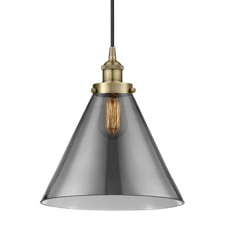 A large image of the Innovations Lighting 616-1PH-15-12-L Cone Pendant Antique Brass / Plated Smoke