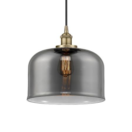 A large image of the Innovations Lighting 616-1PH-12-12-L Bell Pendant Antique Brass / Plated Smoke