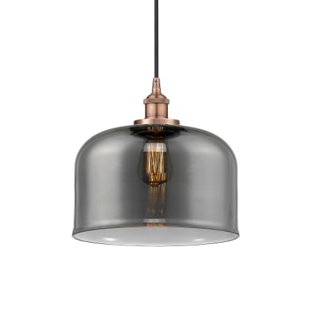 A large image of the Innovations Lighting 616-1PH-12-12-L Bell Pendant Antique Copper / Plated Smoke