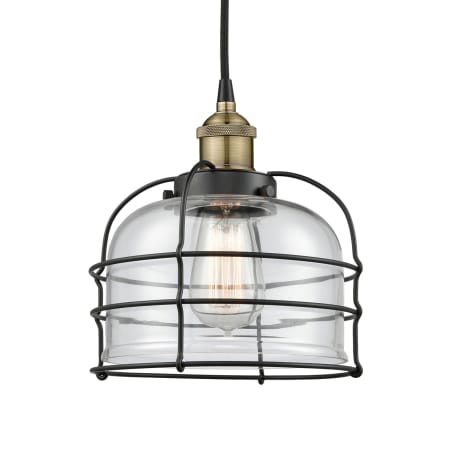 A large image of the Innovations Lighting 616-1PH-10-9 Bell Cage Pendant Black Antique Brass / Clear