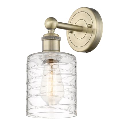 A large image of the Innovations Lighting 616-1W-12-5 Cobbleskill Sconce Antique Brass / Deco Swirl
