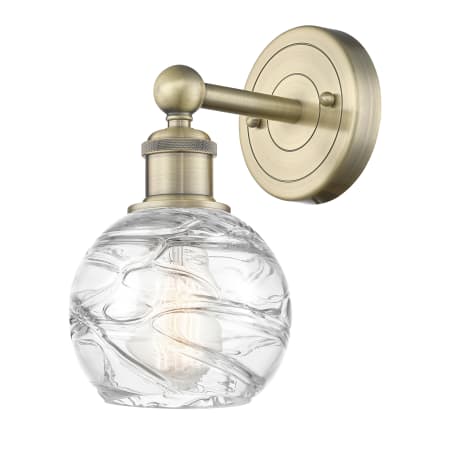 A large image of the Innovations Lighting 616-1W-11-6 Athens Deco Swirl Sconce Antique Brass / Clear Deco Swirl