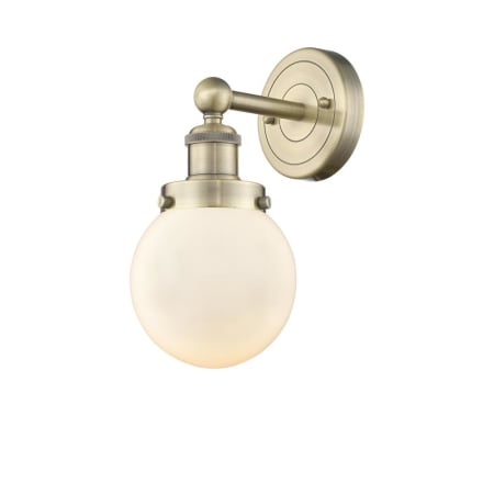 A large image of the Innovations Lighting 616-1W-10-7 Beacon Sconce Antique Brass / Matte White