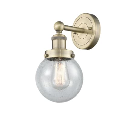 A large image of the Innovations Lighting 616-1W-10-7 Beacon Sconce Antique Brass / Seedy