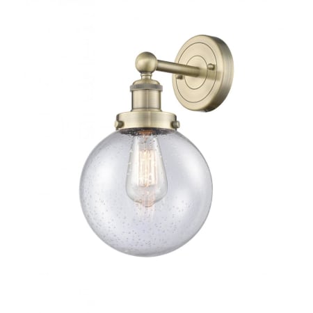 A large image of the Innovations Lighting 616-1W-10-7-L Beacon Sconce Antique Brass / Seedy