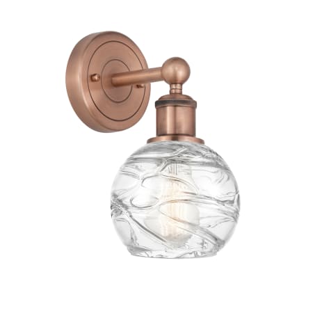 A large image of the Innovations Lighting 616-1W-11-6 Athens Deco Swirl Sconce Antique Copper / Clear Deco Swirl