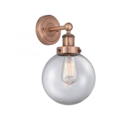 A large image of the Innovations Lighting 616-1W-10-7-L Beacon Sconce Antique Copper / Clear