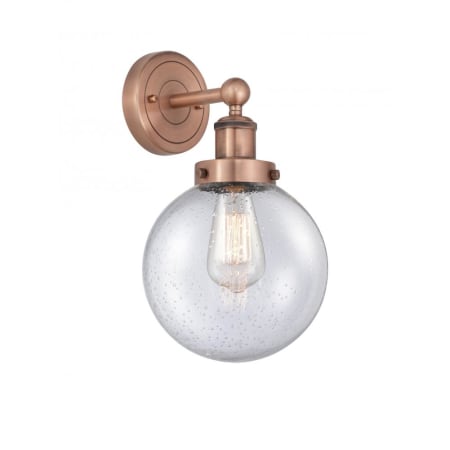 A large image of the Innovations Lighting 616-1W-10-7-L Beacon Sconce Antique Copper / Seedy