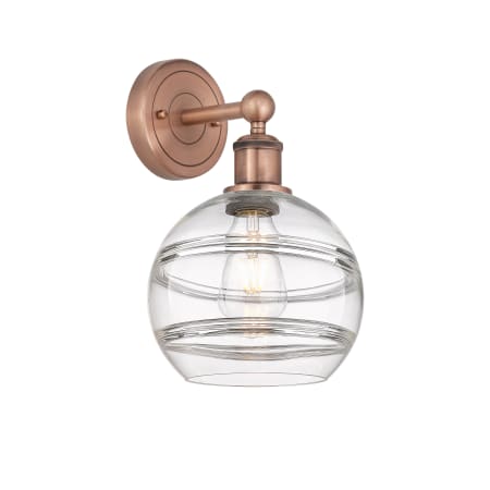 A large image of the Innovations Lighting 616-1W 12 8 Rochester Sconce Antique Copper / Clear