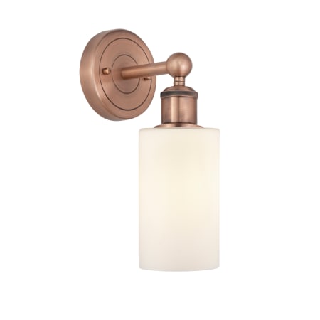 A large image of the Innovations Lighting 616-1W-11-4 Clymer Sconce Antique Copper / Matte White