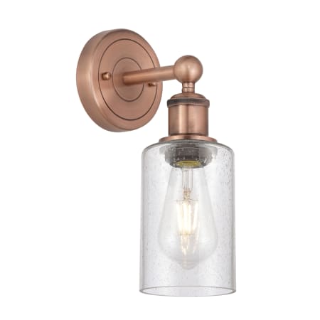 A large image of the Innovations Lighting 616-1W-11-4 Clymer Sconce Antique Copper / Seedy