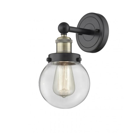 A large image of the Innovations Lighting 616-1W-10-7 Beacon Sconce Black Antique Brass / Clear