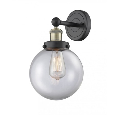 A large image of the Innovations Lighting 616-1W-10-7-L Beacon Sconce Black Antique Brass / Clear