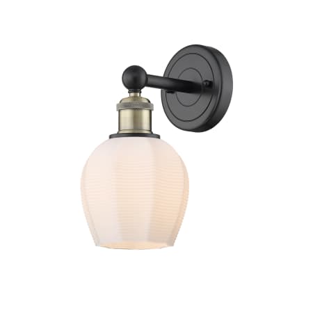 A large image of the Innovations Lighting 616-1W-11-6 Norfolk Sconce Black Antique Brass / Matte White