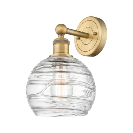 A large image of the Innovations Lighting 616-1W-13-8 Athens Sconce Brushed Brass / Clear Deco Swirl