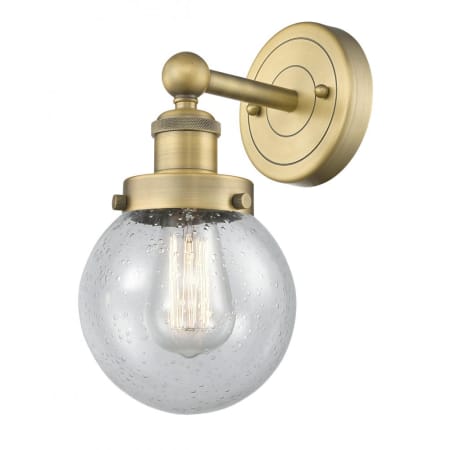 A large image of the Innovations Lighting 616-1W-10-7 Beacon Sconce Brushed Brass / Seedy