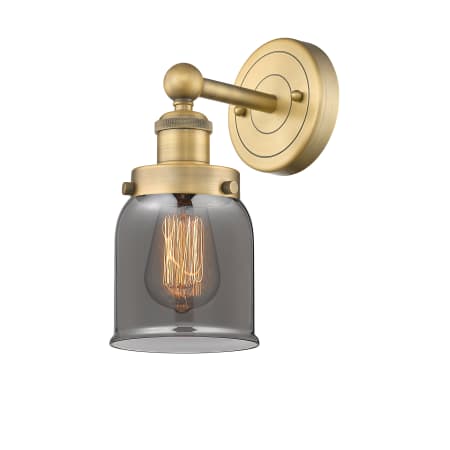 A large image of the Innovations Lighting 616-1W-10-7 Bell Sconce Brushed Brass / Plated Smoke