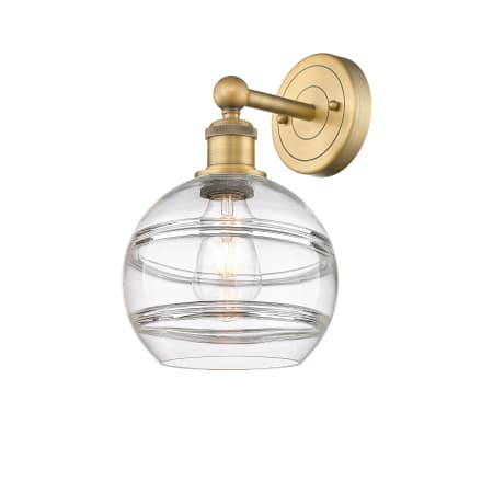 A large image of the Innovations Lighting 616-1W 12 8 Rochester Sconce Brushed Brass / Clear