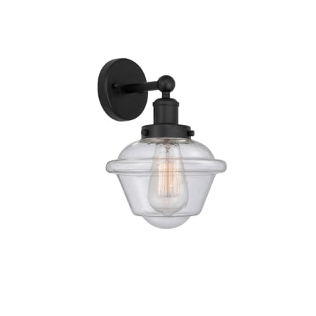 A large image of the Innovations Lighting 616-1W-10-7 Oxford Sconce Matte Black / Seedy