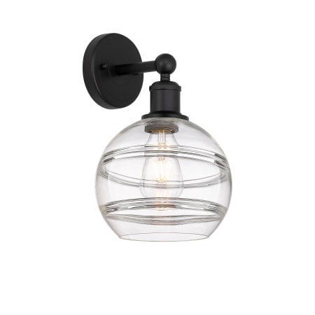 A large image of the Innovations Lighting 616-1W 12 8 Rochester Sconce Matte Black / Clear