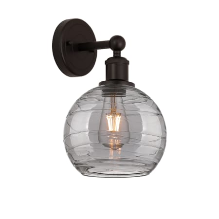 A large image of the Innovations Lighting 616-1W 12 8 Athens Deco Swirl Sconce Oil Rubbed Bronze / Light Smoke Deco Swirl