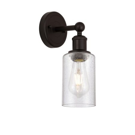 A large image of the Innovations Lighting 616-1W-11-4 Clymer Sconce Oil Rubbed Bronze / Seedy