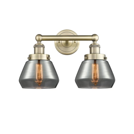 A large image of the Innovations Lighting 616-2W-10-16 Fulton Vanity Antique Brass / Plated Smoke