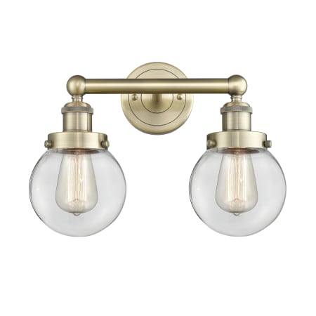 A large image of the Innovations Lighting 616-2W-10-16 Beacon Vanity Antique Brass / Clear