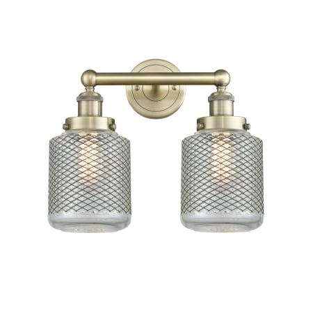 A large image of the Innovations Lighting 616-2W-12-15 Stanton Vanity Antique Brass / Clear Wire Mesh