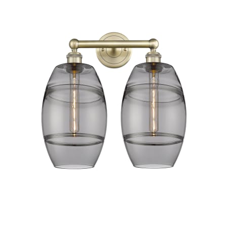 A large image of the Innovations Lighting 616-2W 12 17 Vaz Vanity Antique Brass / Light Smoke