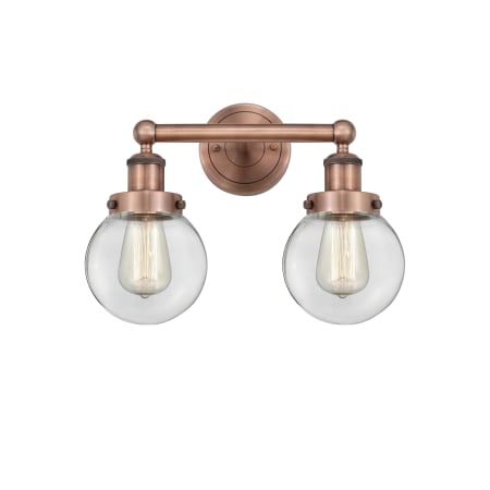 A large image of the Innovations Lighting 616-2W-10-16 Beacon Vanity Antique Copper / Clear