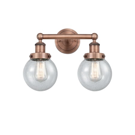 A large image of the Innovations Lighting 616-2W-10-16 Beacon Vanity Antique Copper / Seedy