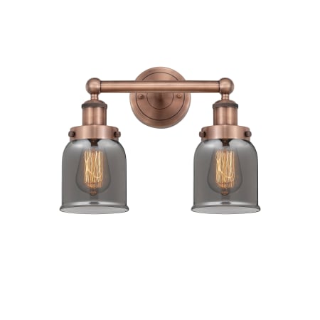 A large image of the Innovations Lighting 616-2W-10-16 Bell Vanity Antique Copper / Plated Smoke