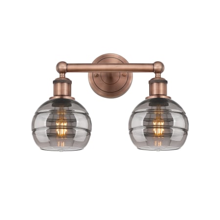 A large image of the Innovations Lighting 616-2W 10 15 Rochester Vanity Antique Copper / Light Smoke