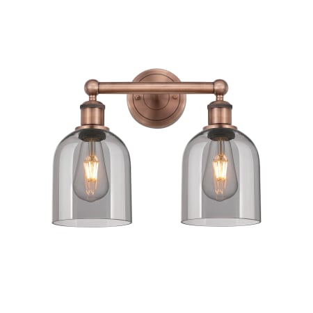 A large image of the Innovations Lighting 616-2W 12 15 Bella Vanity Antique Copper / Light Smoke