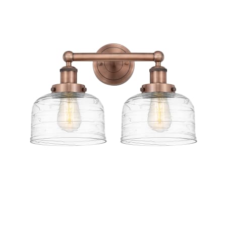 A large image of the Innovations Lighting 616-2W-10-16-L Bell Vanity Antique Copper / Clear Deco Swirl