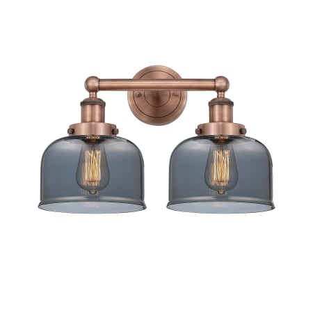 A large image of the Innovations Lighting 616-2W-10-16-L Bell Vanity Antique Copper / Plated Smoke