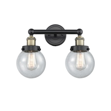 A large image of the Innovations Lighting 616-2W-10-16 Beacon Vanity Black Antique Brass / Seedy