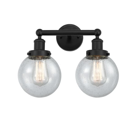 A large image of the Innovations Lighting 616-2W-10-16 Beacon Vanity Matte Black / Seedy