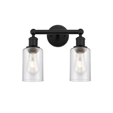 A large image of the Innovations Lighting 616-2W-11-13 Clymer Vanity Matte Black / Seedy