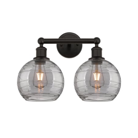 A large image of the Innovations Lighting 616-2W 12 17 Athens Deco Swirl Vanity Oil Rubbed Bronze / Light Smoke Deco Swirl