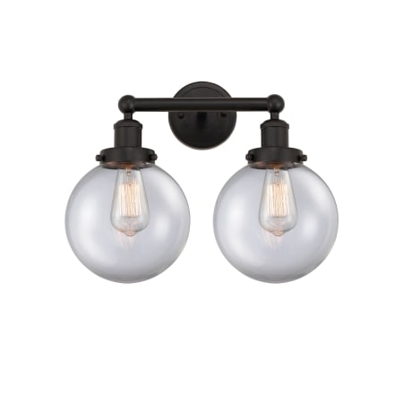 A large image of the Innovations Lighting 616-2W-10-16-L Beacon Vanity Oil Rubbed Bronze / Clear