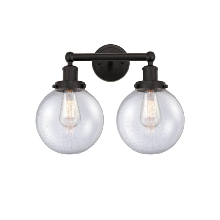 A large image of the Innovations Lighting 616-2W-10-16-L Beacon Vanity Oil Rubbed Bronze / Seedy