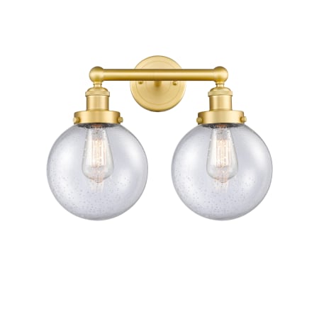 A large image of the Innovations Lighting 616-2W-10-16-L Beacon Vanity Satin Gold / Seedy