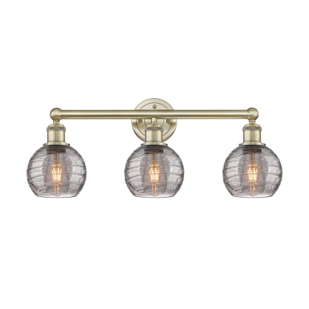 A large image of the Innovations Lighting 616-3W 10 24 Athens Deco Swirl Vanity Antique Brass / Light Smoke Deco Swirl