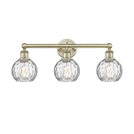 A large image of the Innovations Lighting 616-3W-11-24 Athens Vanity Antique Brass / Clear Water Glass