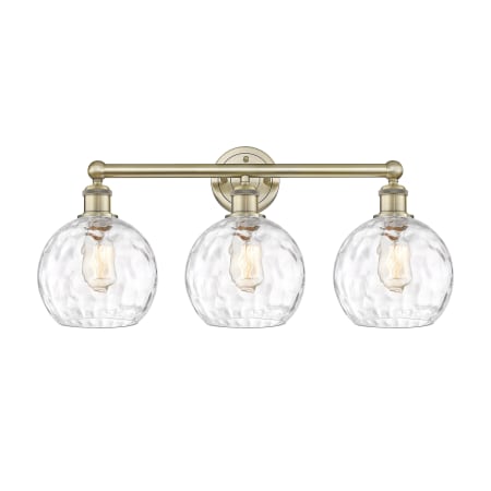 A large image of the Innovations Lighting 616-3W-13-26 Athens Vanity Antique Brass / Clear Water Glass