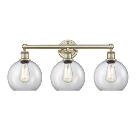 A large image of the Innovations Lighting 616-3W-13-26 Athens Vanity Antique Brass / Clear