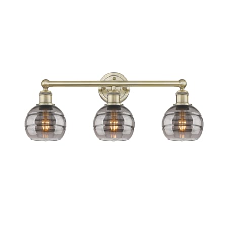 A large image of the Innovations Lighting 616-3W 10 24 Rochester Vanity Antique Brass / Light Smoke