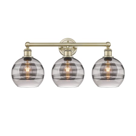 A large image of the Innovations Lighting 616-3W 12 26 Rochester Vanity Antique Brass / Light Smoke